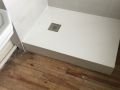 Adjustable feet / pedestals for shower tray